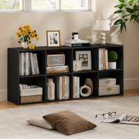 Black bookshelf with decorative items in a living room setting